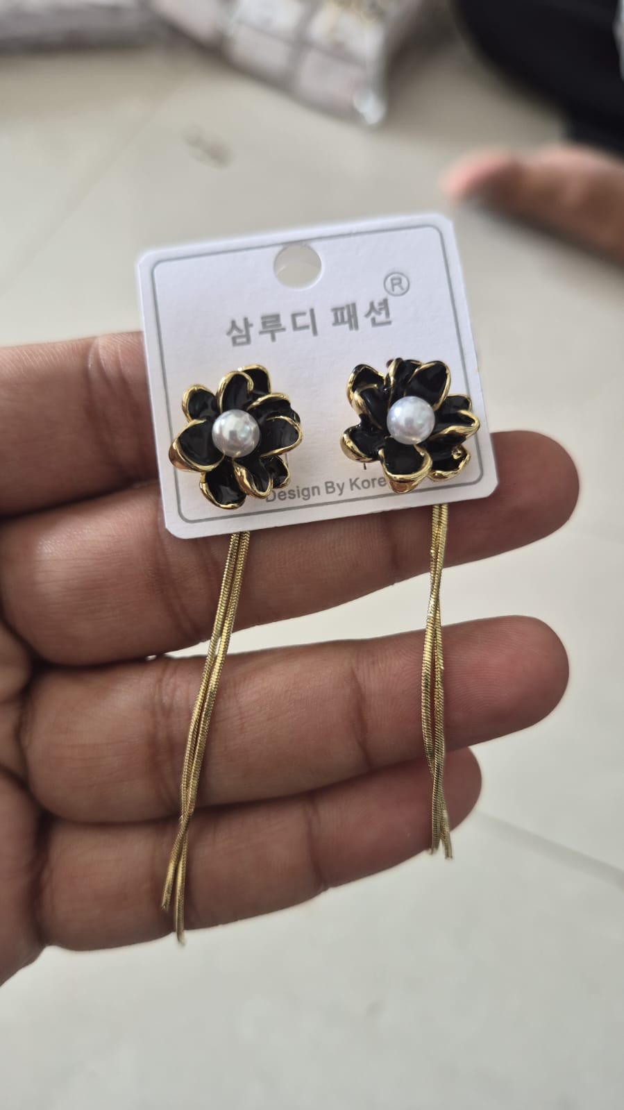 black enamelled flower earrings long dangling chain tassels.